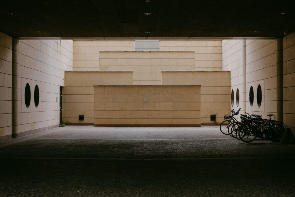 a couple of bikes parked in a parking garage